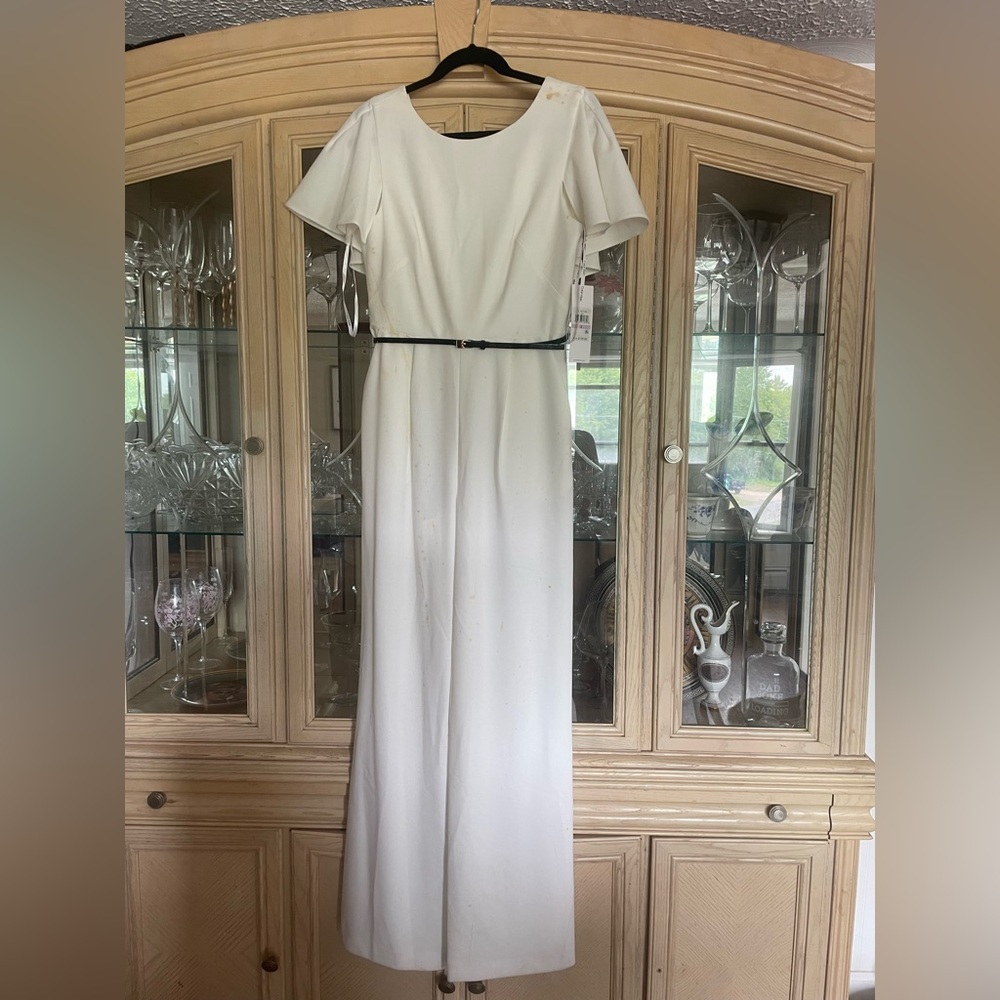 NWT Calvin Klein jumpsuit. Never worn, BUT IS COVERED IN STAINS
